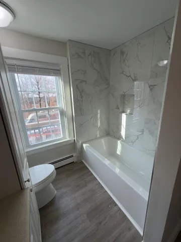 a bathroom with a bathtub and a sink
