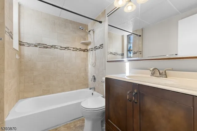 a bathroom with a sink a toilet and a bathtub