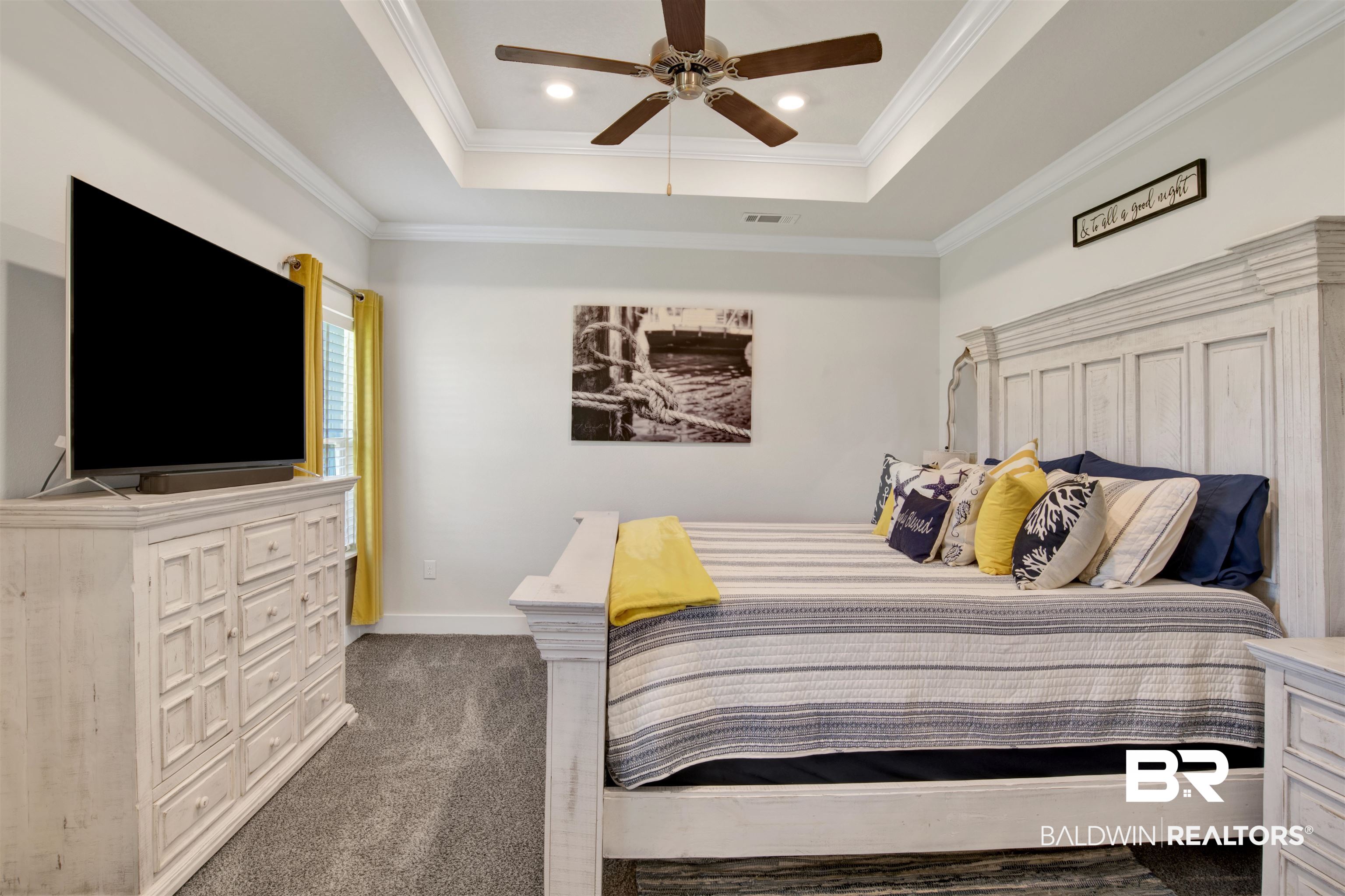 10113 Lakeview Drive Foley, AL 36535 - Photo 20 of 34 Carpeted bedroom featuring crown molding, a tray ceiling, and ceiling fan