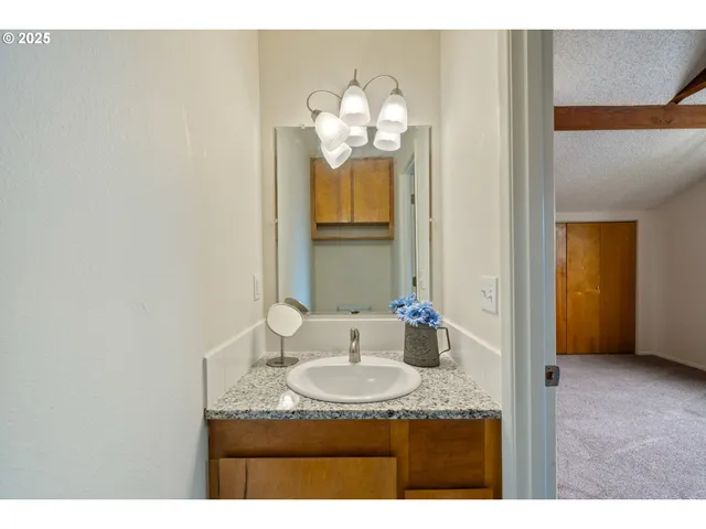 a view of an empty room with wooden walls