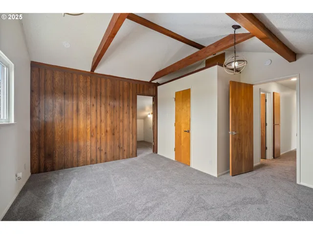 a bathroom with a granite countertop toilet sink and mirror