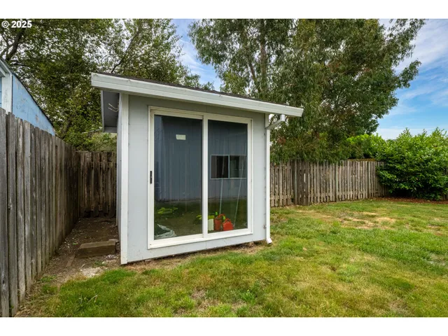 a view of an empty room and a window