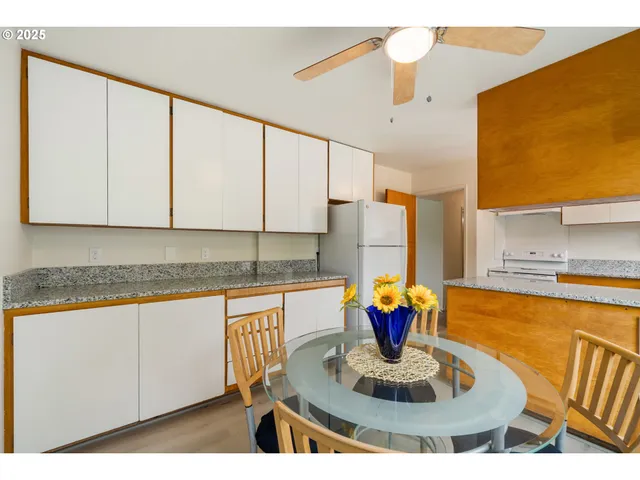 a kitchen with a table and chairs