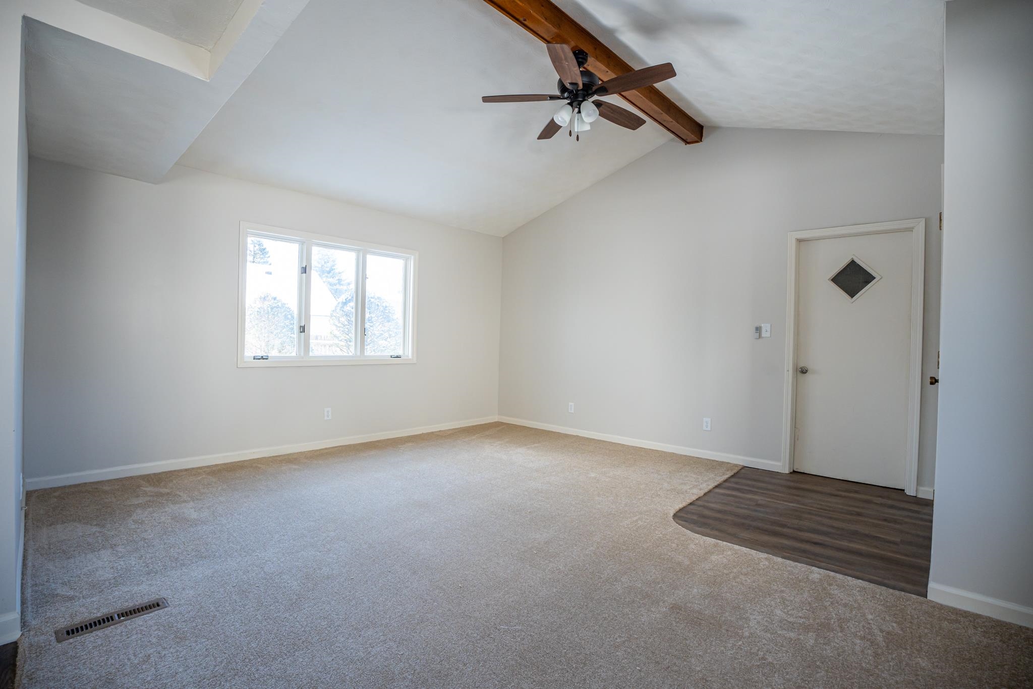 1070 North 8th Street Rochelle, IL 61068 - Photo 20 of 66 an empty room with windows and ceiling fan