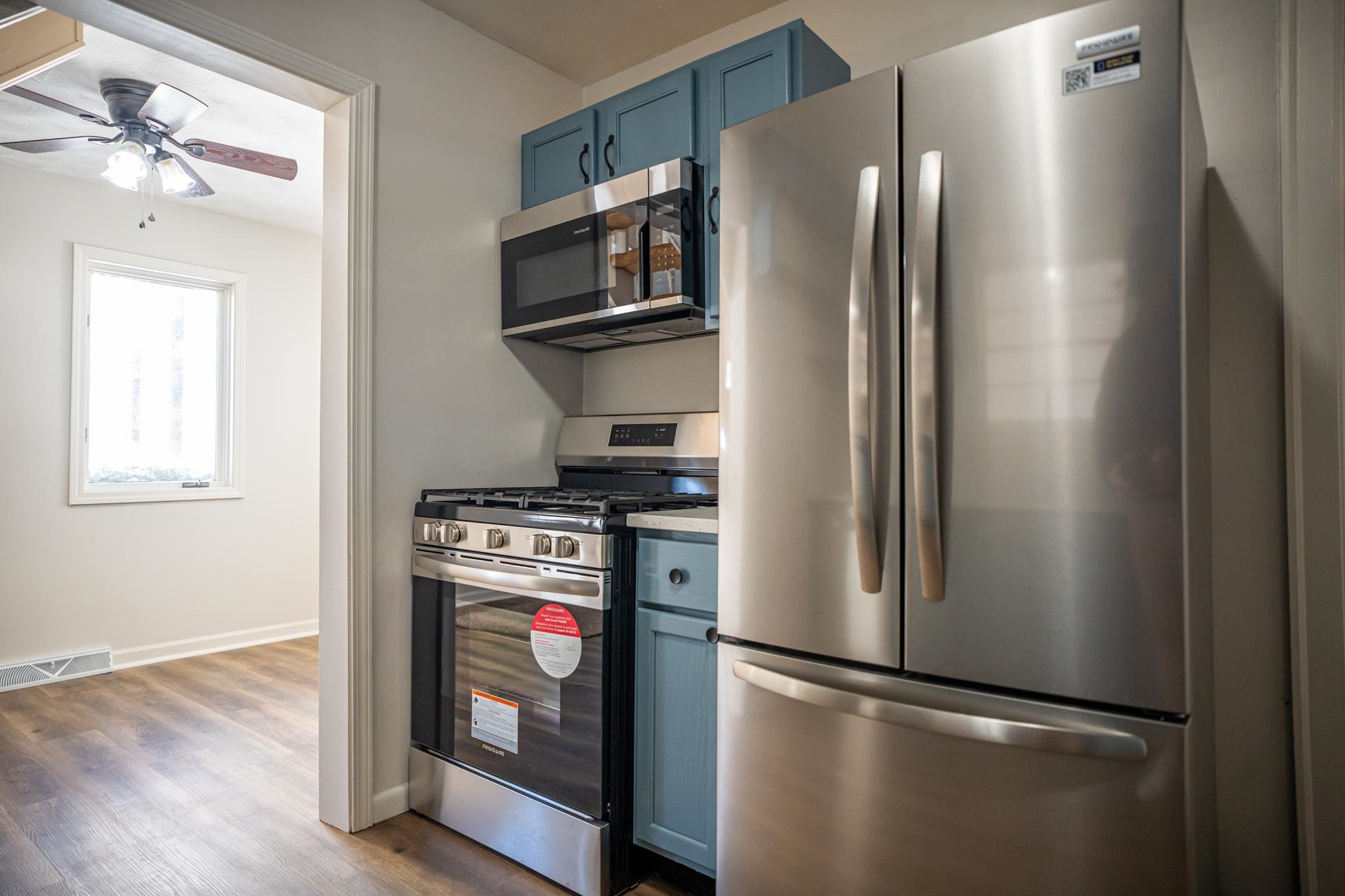 1070 North 8th Street Rochelle, IL 61068 - Photo 34 of 66 a kitchen with stainless steel appliances granite countertop a refrigerator and a stove top oven