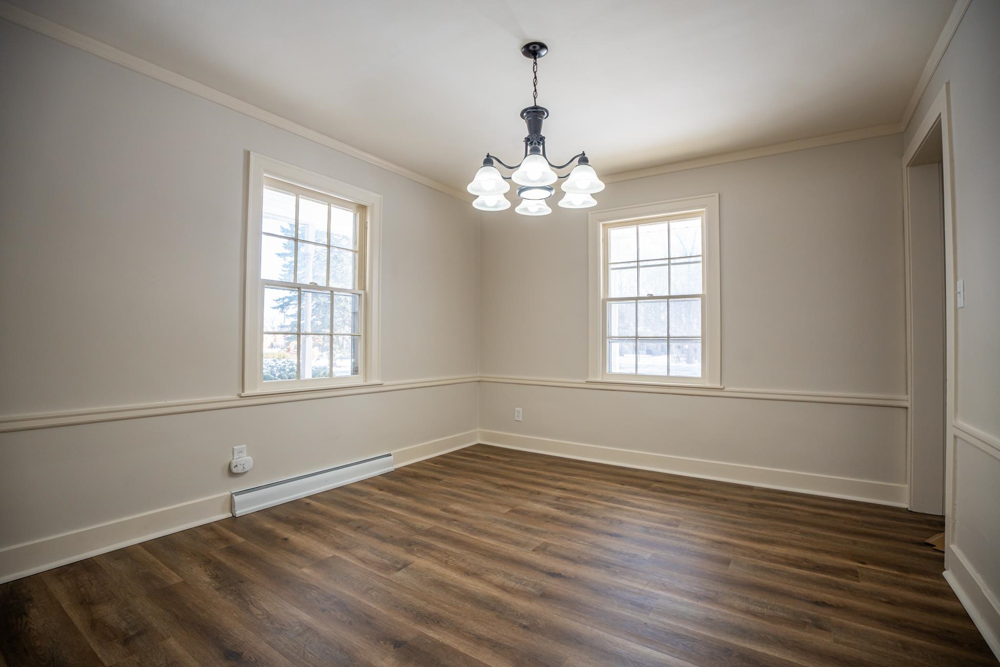 1070 North 8th Street Rochelle, IL 61068 - Photo 35 of 66 an empty room with wooden floor and windows