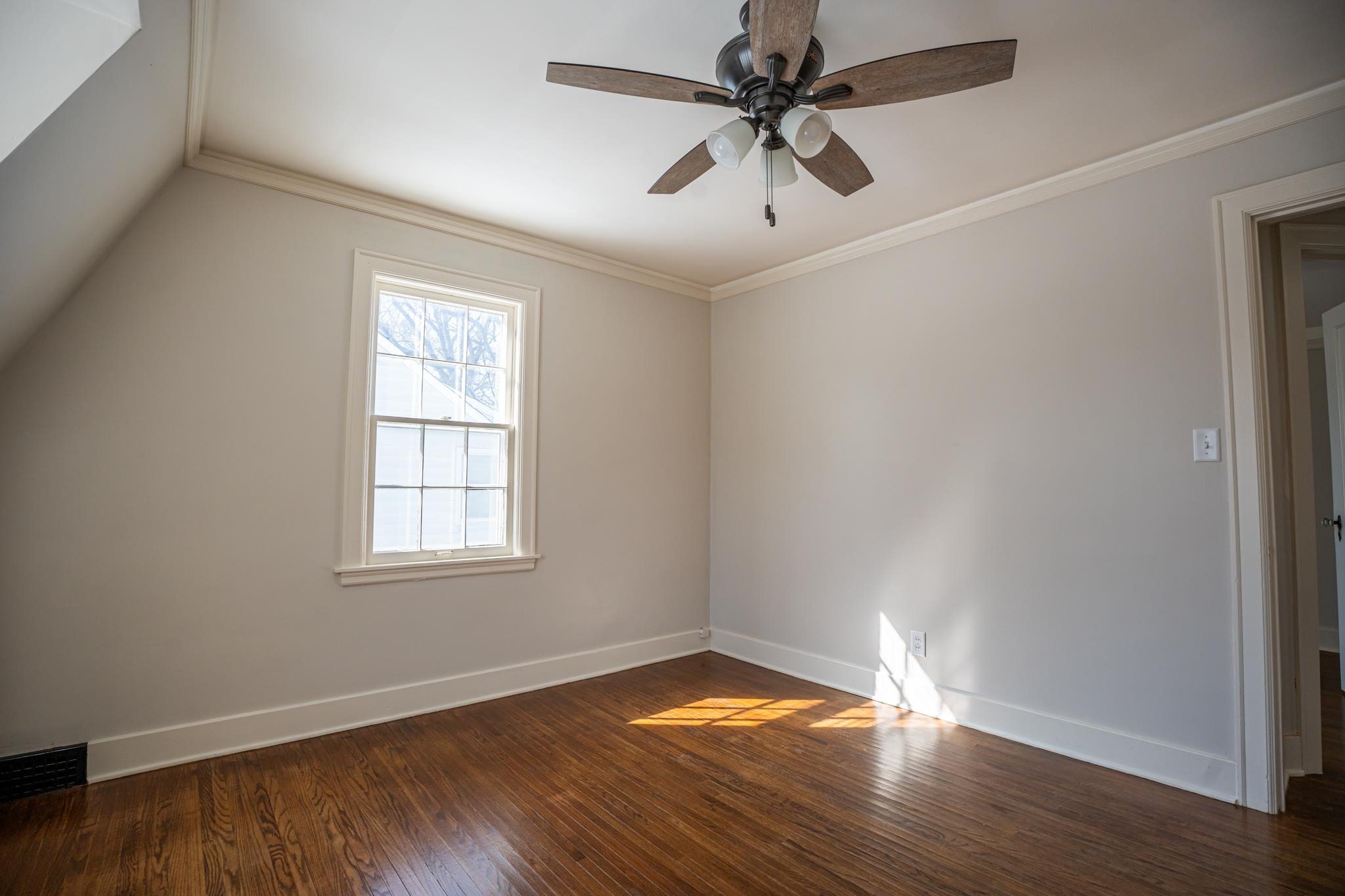 1070 North 8th Street Rochelle, IL 61068 - Photo 46 of 66 an empty room with wooden floor and windows