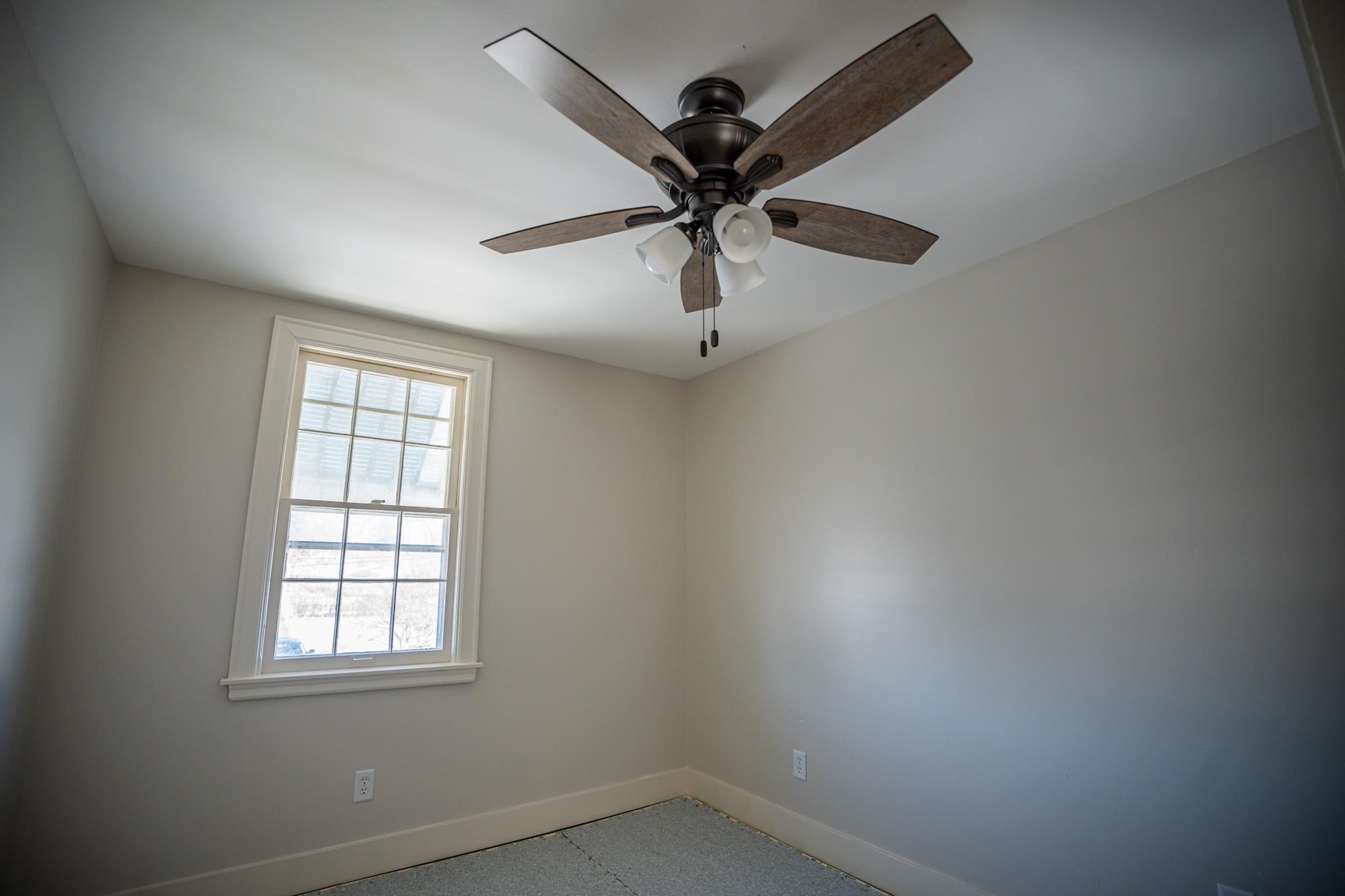 1070 North 8th Street Rochelle, IL 61068 - Photo 48 of 66 an empty room with a window and a fan