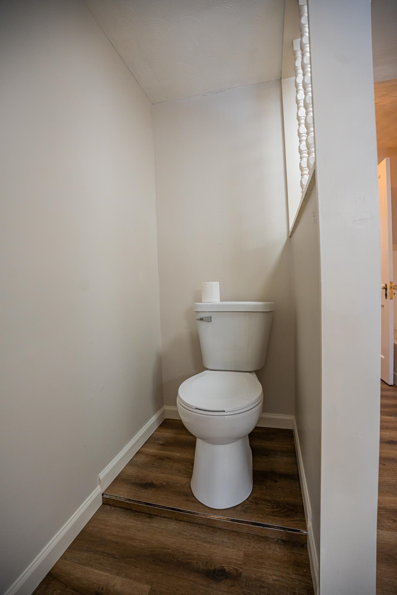 1070 North 8th Street Rochelle, IL 61068 - Photo 54 of 66 a bathroom with a toilet and a mirror