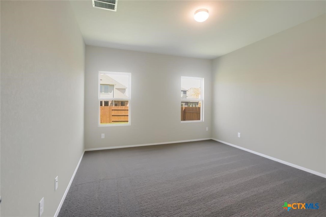2428 Ambling Trail Georgetown, TX 78628 - Photo 13 of 33 an empty room with windows