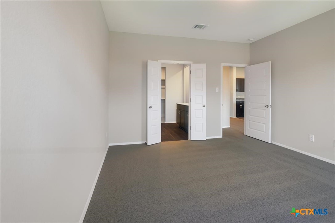 2428 Ambling Trail Georgetown, TX 78628 - Photo 14 of 33 a view of a bedroom