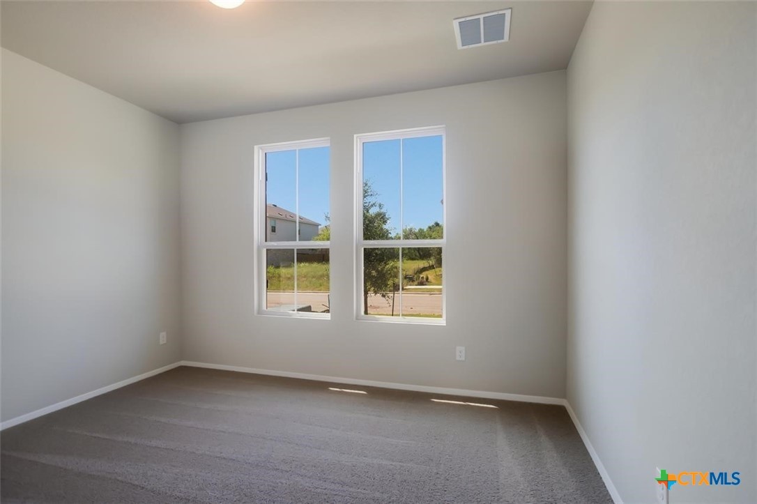 2428 Ambling Trail Georgetown, TX 78628 - Photo 17 of 33 an empty room with a window