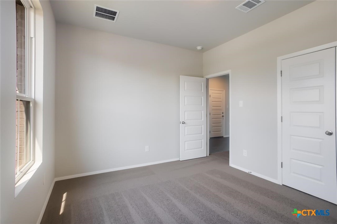 2428 Ambling Trail Georgetown, TX 78628 - Photo 18 of 33 an empty room with window