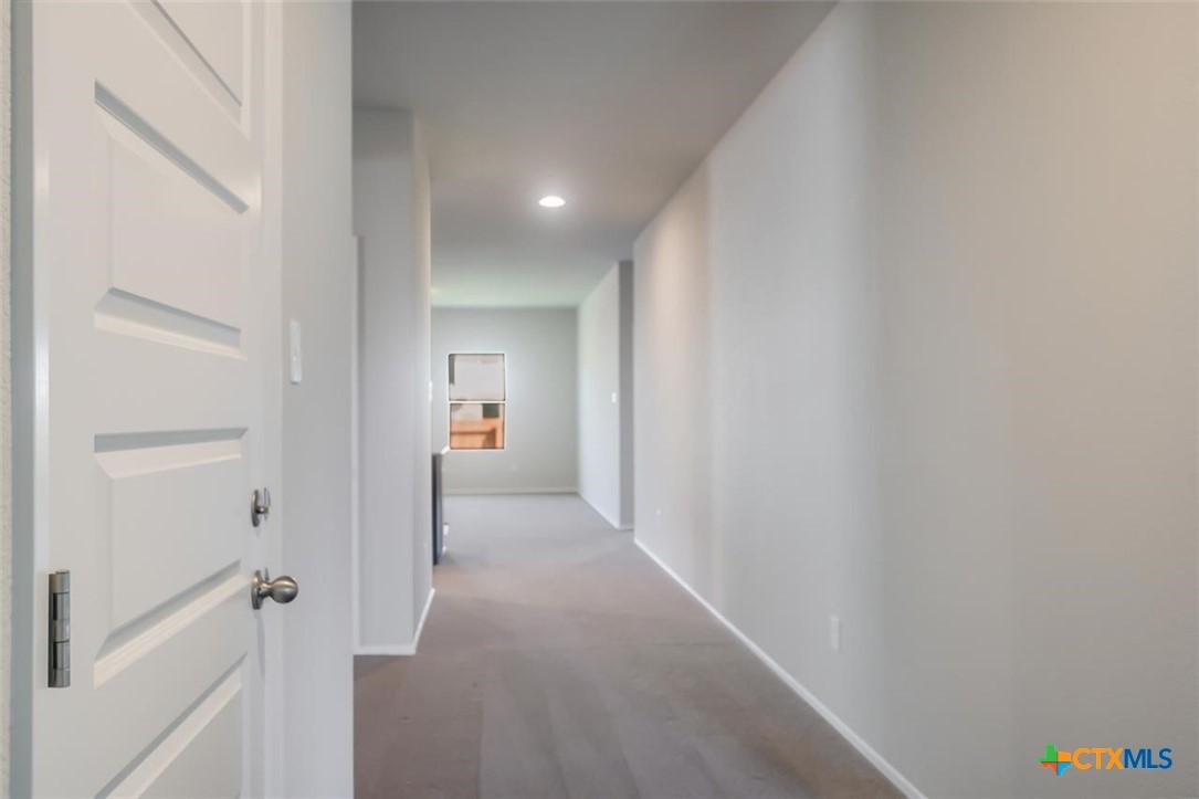 2428 Ambling Trail Georgetown, TX 78628 - Photo 19 of 33 a view of a hallway with closet