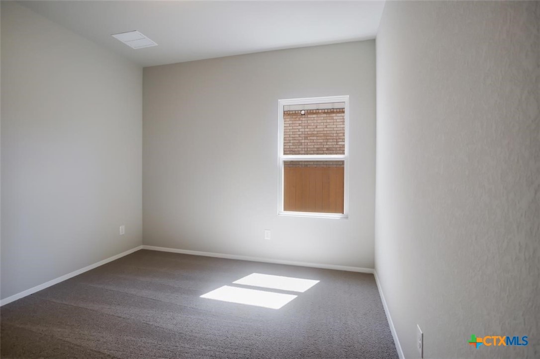 2428 Ambling Trail Georgetown, TX 78628 - Photo 21 of 33 an empty room with windows