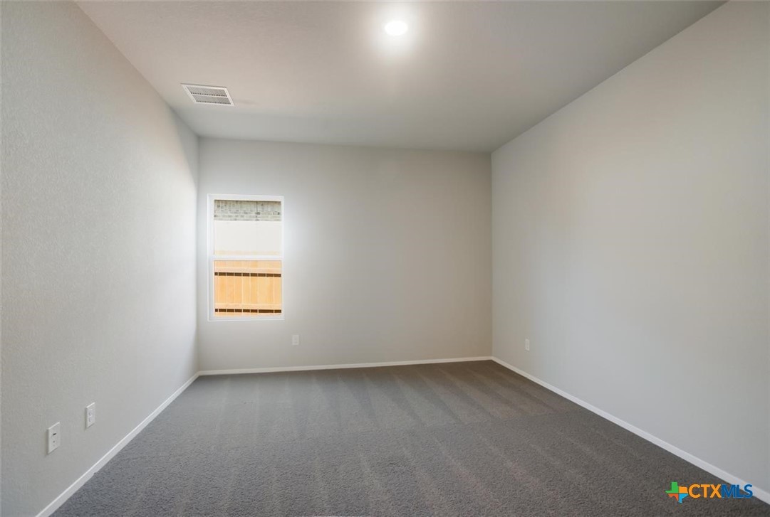 2428 Ambling Trail Georgetown, TX 78628 - Photo 23 of 33 an empty room with a window