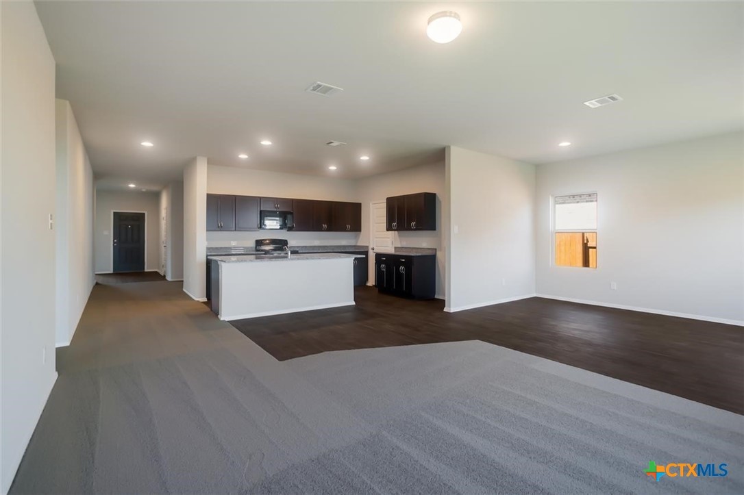 2428 Ambling Trail Georgetown, TX 78628 - Photo 10 of 33 a view of kitchen with wooden floor and electronic appliances