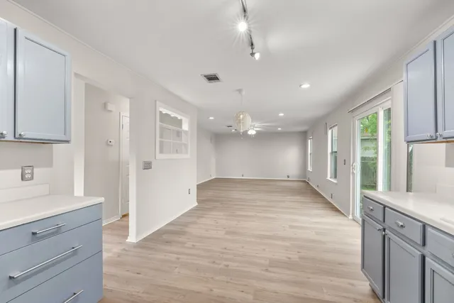 a view of a kitchen cabinets and wooden floor