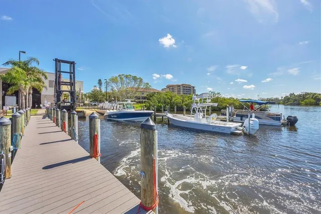 a view of a lake with houses in the back