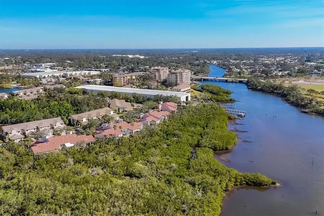 a view of a lake with houses in the back