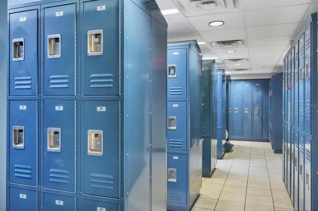a bathroom with a sink mirror and a shower