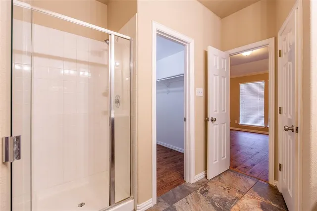 a view of a bathroom with shower