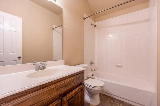 a bathroom with a sink a toilet and a bathtub