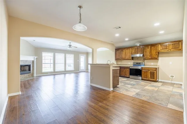 a view of kitchen with cabinets and wooden floor