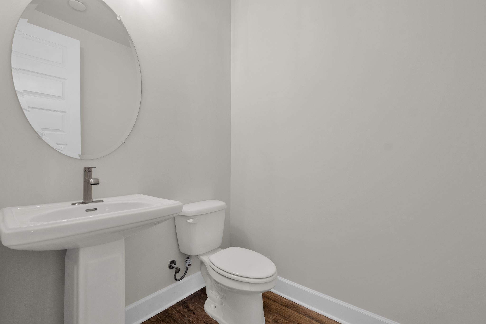 263 Pin High Drive Mount Juliet, TN 37122 - Photo 11 of 34 a bathroom with a toilet a sink and mirror