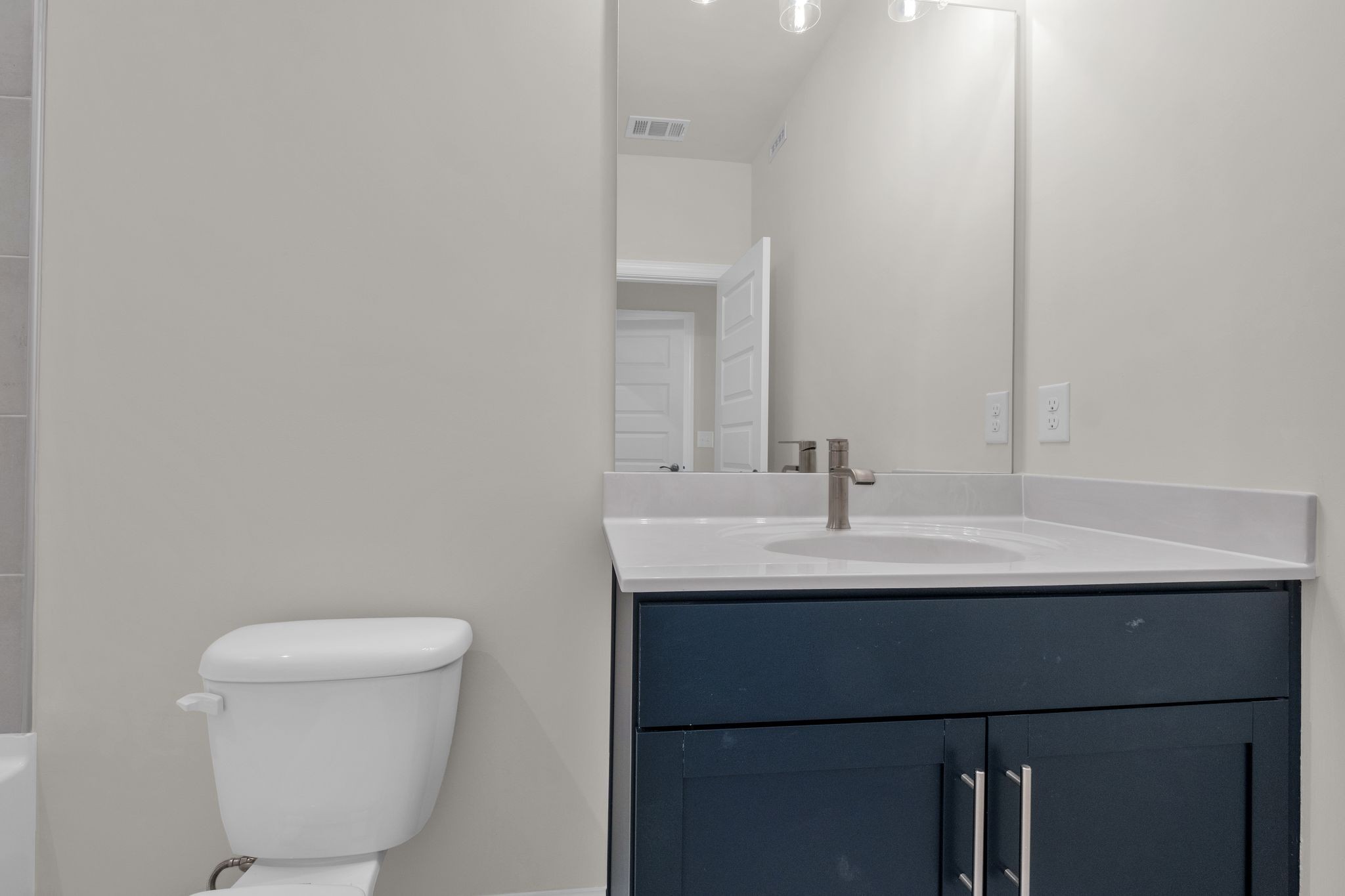 263 Pin High Drive Mount Juliet, TN 37122 - Photo 27 of 34 a bathroom with a sink a toilet and a mirror
