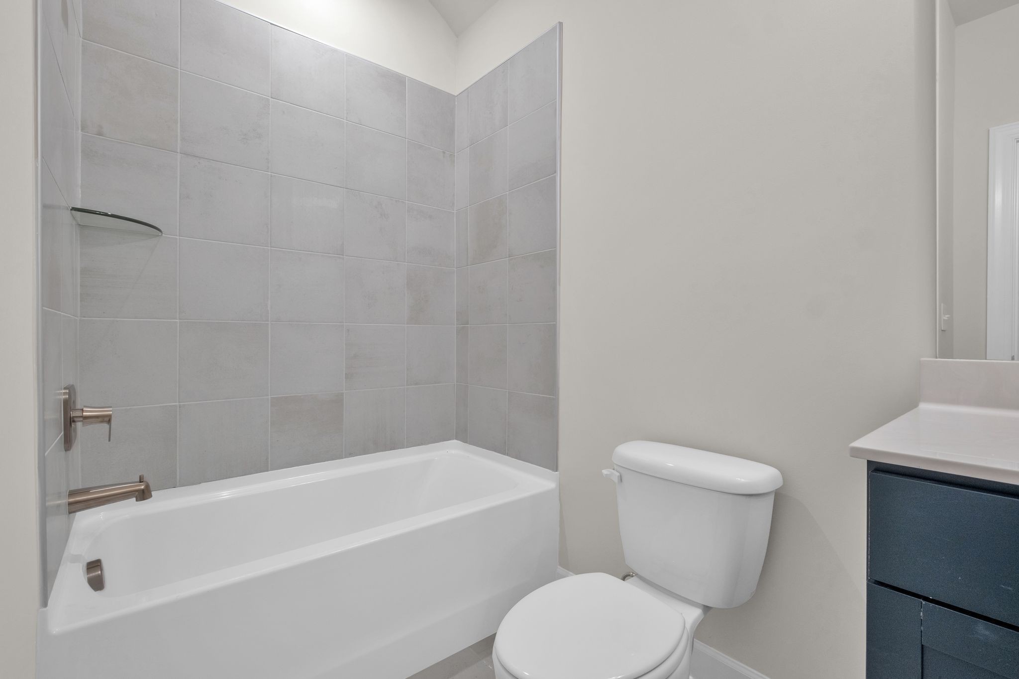 263 Pin High Drive Mount Juliet, TN 37122 - Photo 28 of 34 a white toilet and tub sitting next to a white cabinet