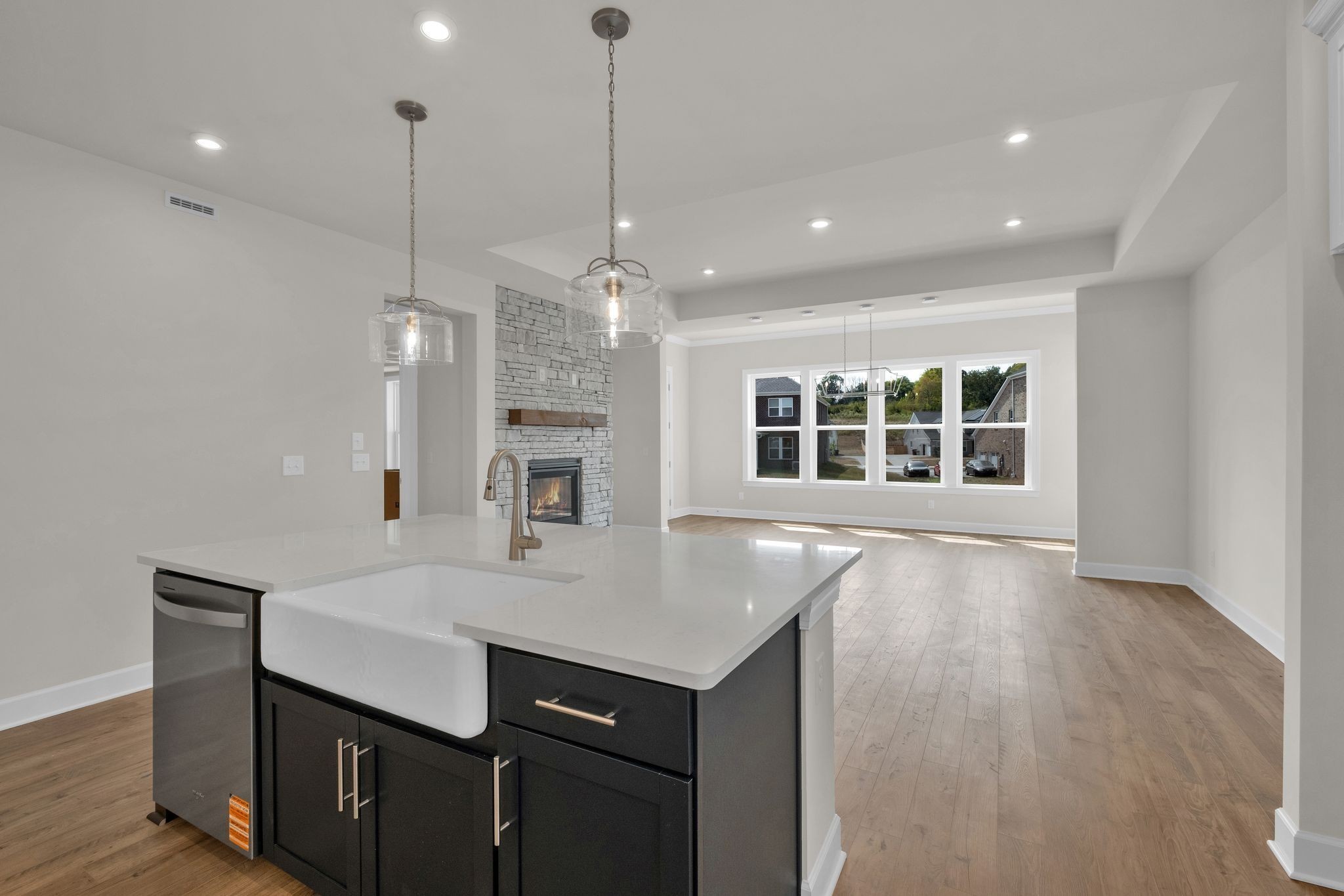 263 Pin High Drive Mount Juliet, TN 37122 - Photo 6 of 34 a kitchen with a sink center island wooden floor appliances and a living room view
