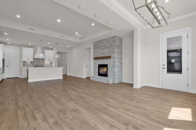 a view of a kitchen with a sink and a fireplace