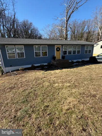 a front view of a house with yard