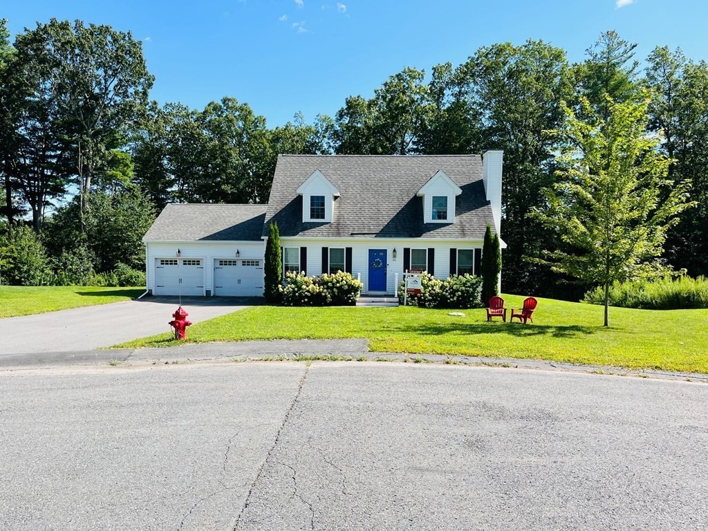 206 Haymeadow Lane Ayer, MA 01432 - Photo 1 of 41 a view of pool and red trees in front of it
