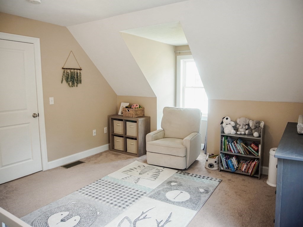 206 Haymeadow Lane Ayer, MA 01432 - Photo 28 of 41 a living room with furniture and a window
