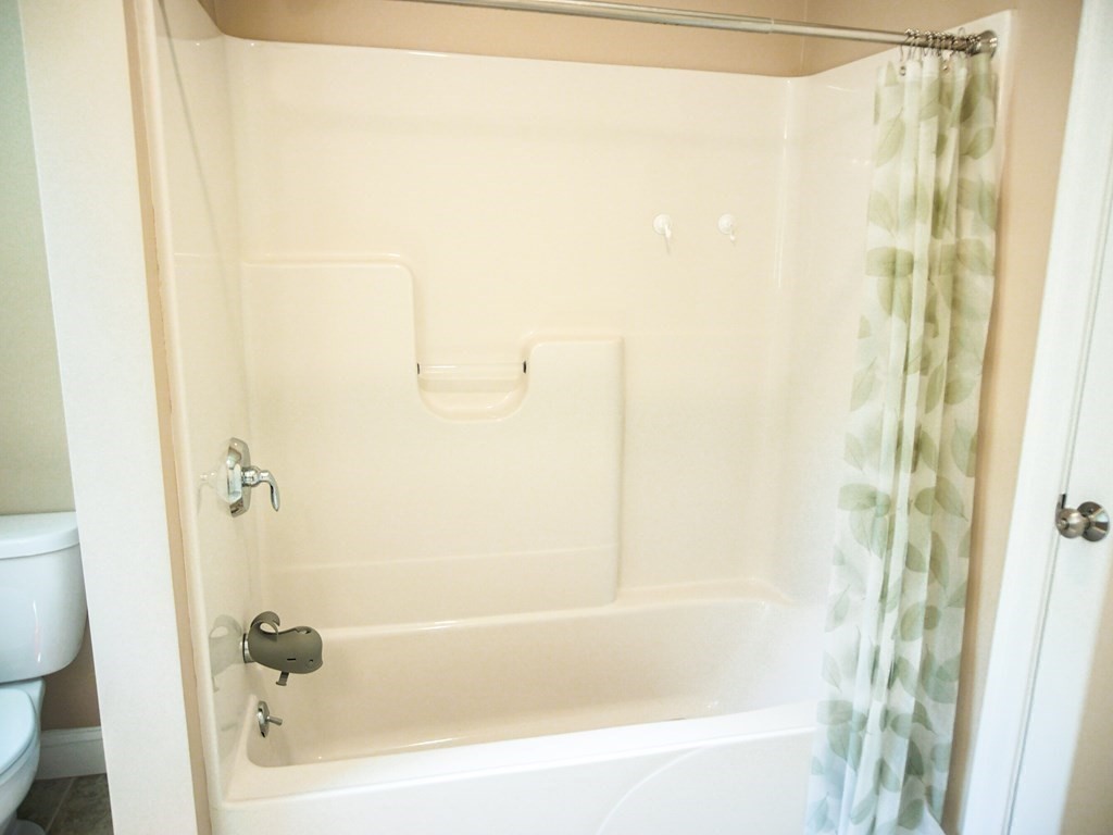 206 Haymeadow Lane Ayer, MA 01432 - Photo 30 of 41 a bathroom with a bathtub and a shower