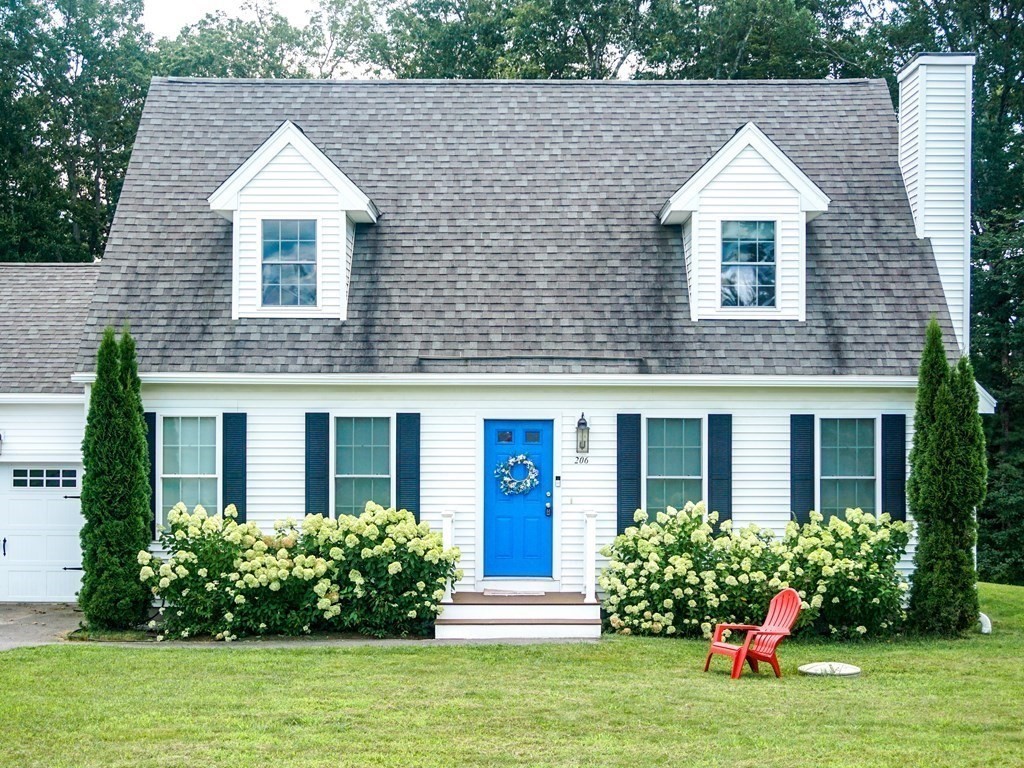206 Haymeadow Lane Ayer, MA 01432 - Photo 3 of 41 a front view of a house with garden
