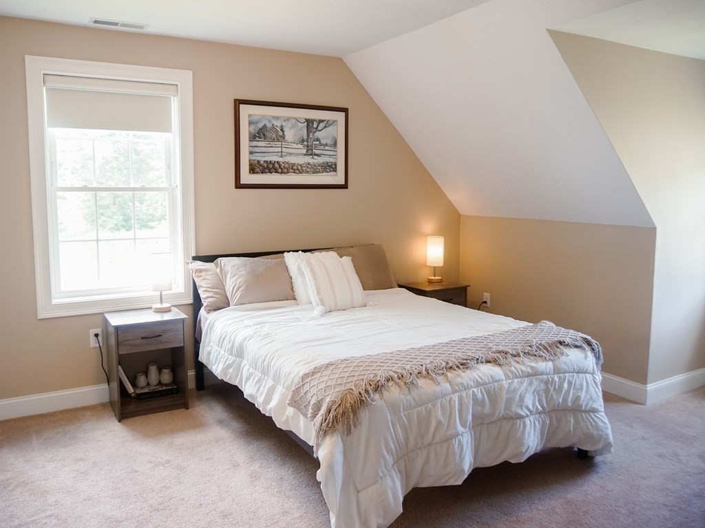 206 Haymeadow Lane Ayer, MA 01432 - Photo 32 of 41 a bedroom with a bed and a window