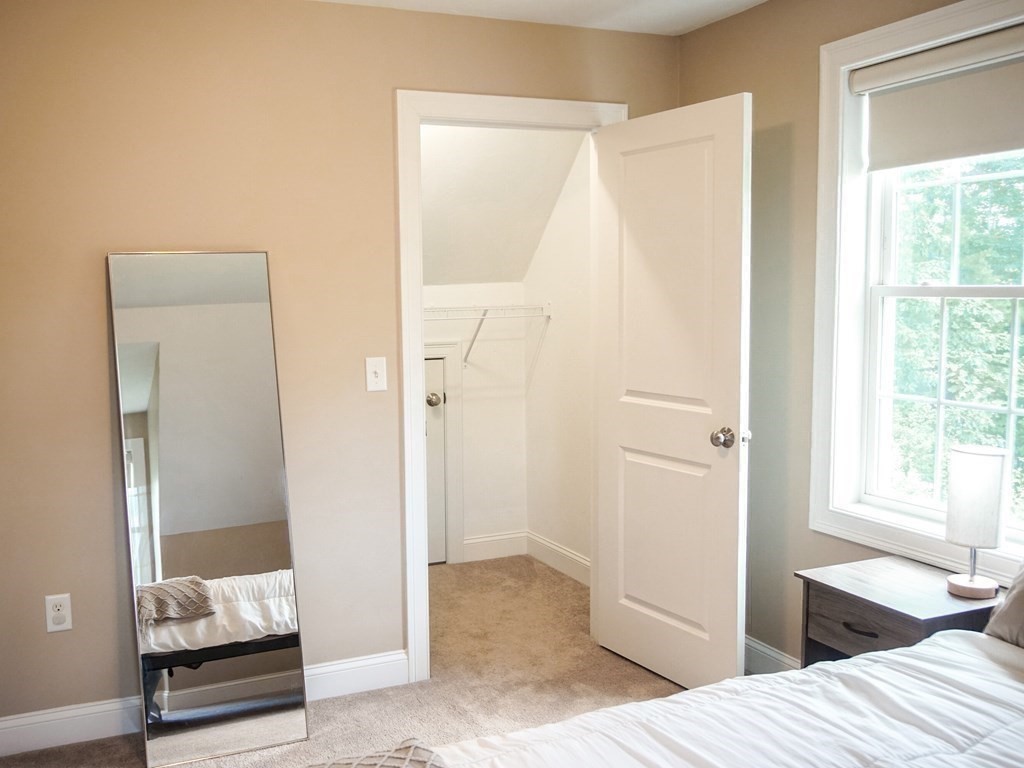206 Haymeadow Lane Ayer, MA 01432 - Photo 35 of 41 a bedroom with a bed and the view of bathroom