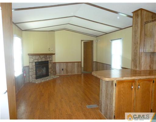 22-22 Longfellow Road North Brunswick, NJ 08902 - Photo 2 of 9 a view of a hallway with a fireplace