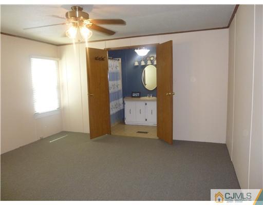 22-22 Longfellow Road North Brunswick, NJ 08902 - Photo 5 of 9 a view of a hallway with a chandelier