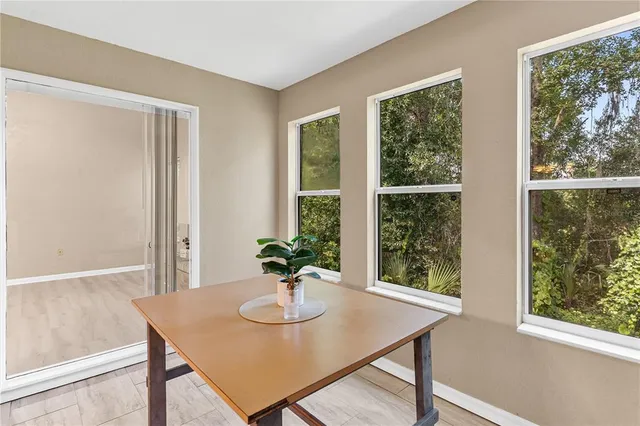 a view of a room with a window and dining table