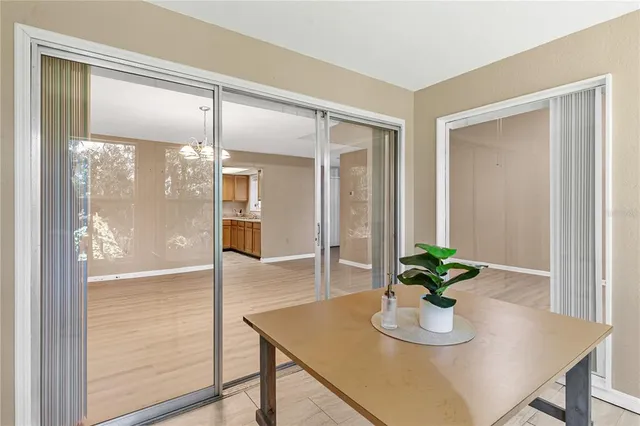 a dining room with furniture and wooden floor