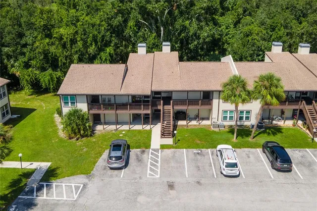 a view of backyard with outdoor seating and green space