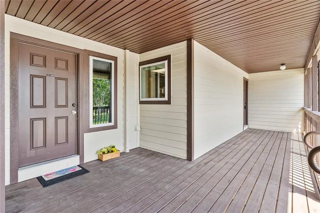 a front view of a house with wooden floor