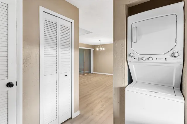 a view of a hallway with washer and dryer