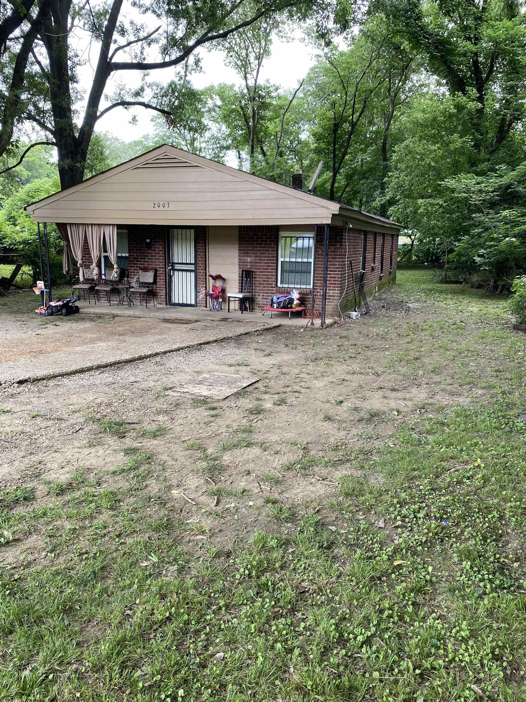 2003 Kansas Street Memphis, TN 38109 - Photo 2 of 4 a front view of a house with yard