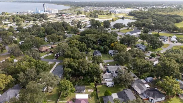 an aerial view of ocean with residential house with outdoor space and lake view