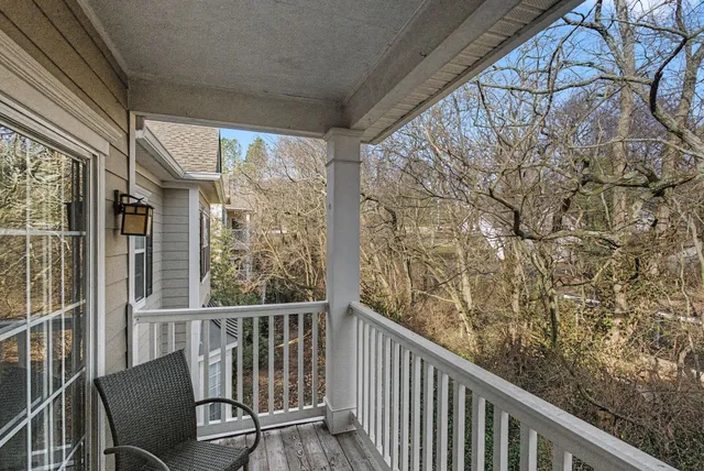 a view of a balcony with furniture